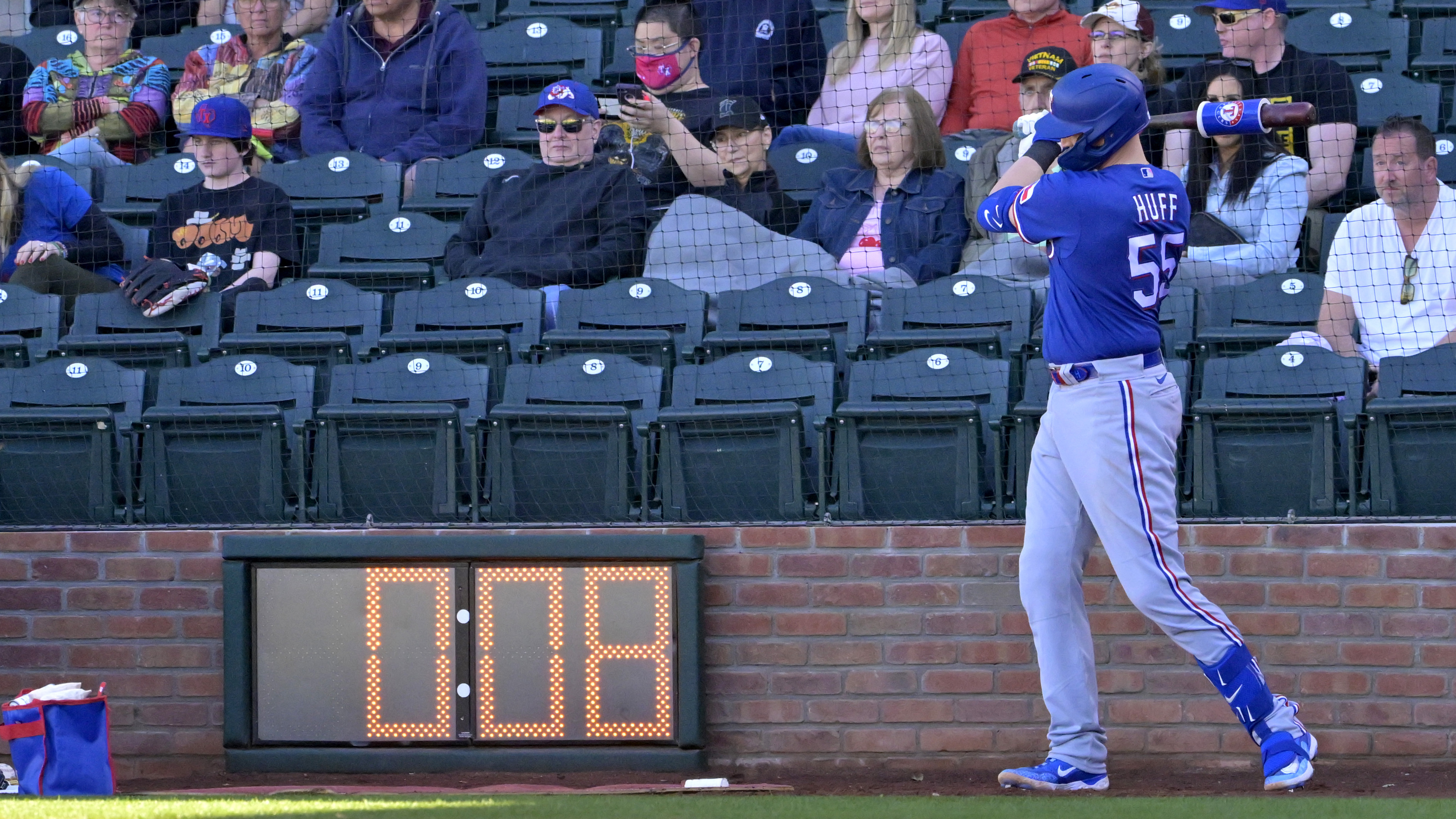 exas Rangers catcher Sam Huff waits in the batting circle as the pitch timer winds down.